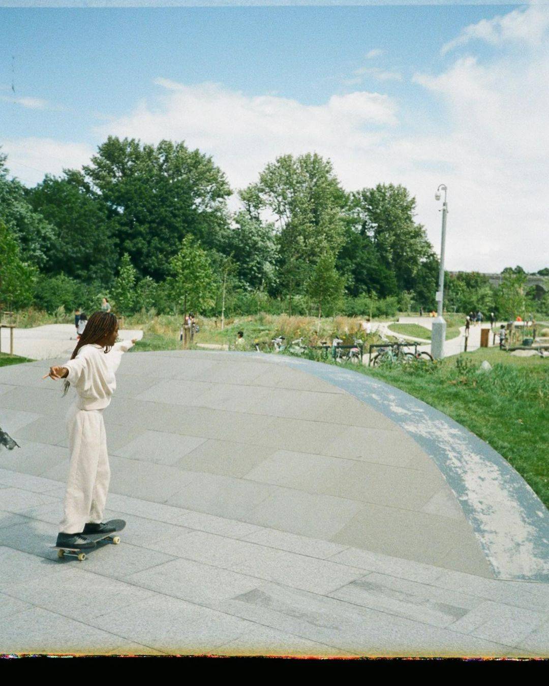 Skateboarders being filmed skating